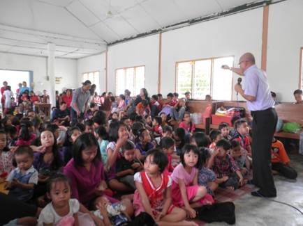 Over 100 children sat on mats filling the floor of a church in Kampung Simboh, Malaysia during a Vacation Bible School uniquely held in the evenings with a separate evangelistic seminar organized for the adults on August 2-8. [photo courtesy of Joggery Gelu]