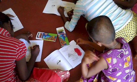 A children colors during an activity at the 